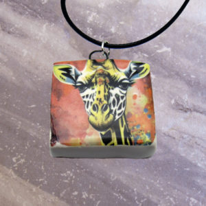 Abstract giraffe pendant necklace on gray background